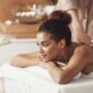 beautiful african woman smiling enjoying massage spa resort 1 85x85